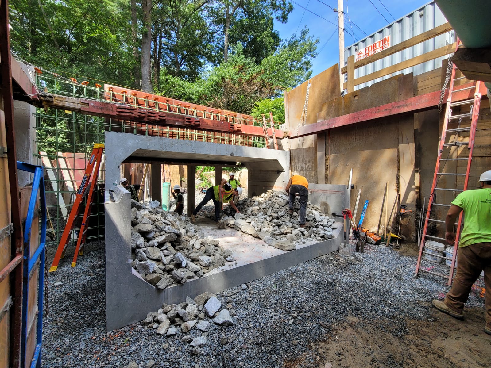 Albanese D&S crew installing a precast structure in a shored excavation